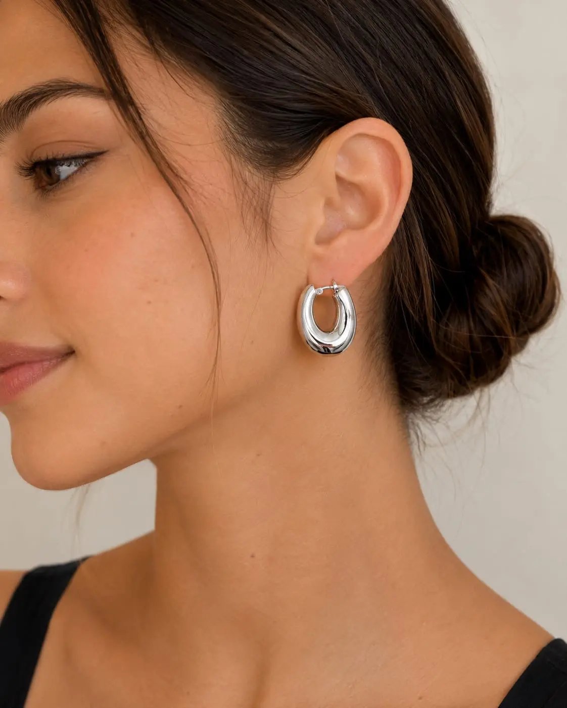 Model wearing Samvelli 925 sterling silver chunky hoop earrings