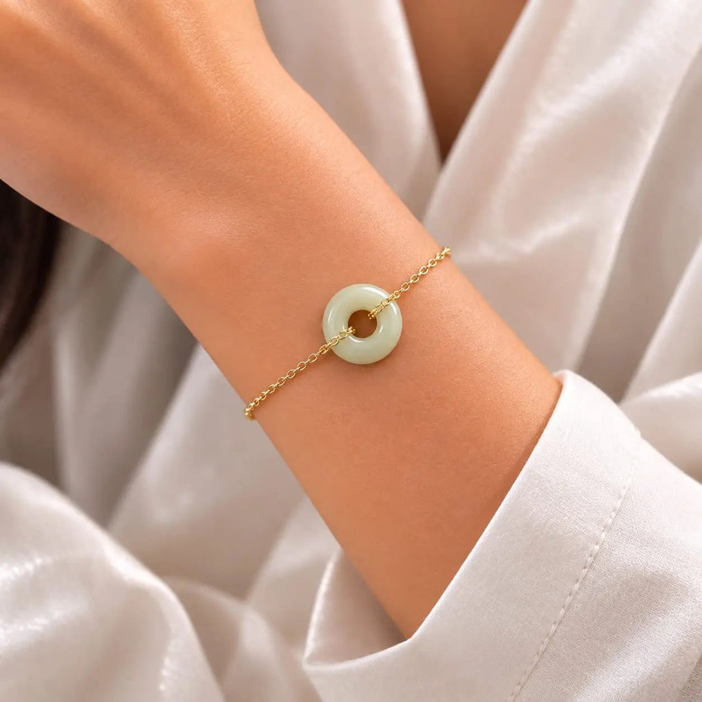 Model wearing an olive green jade donut bracelet by SAMVELLI