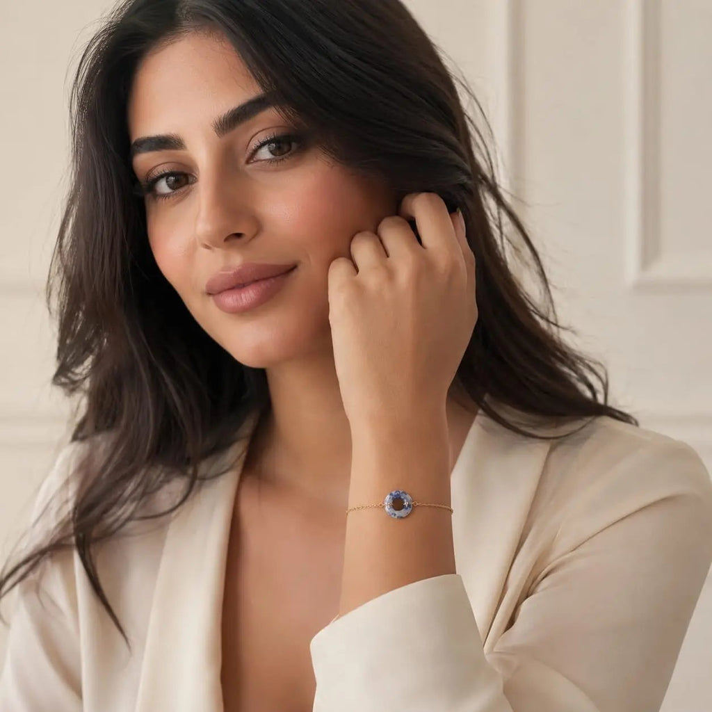 Model wearing a blue and white sodalite donut bracelet