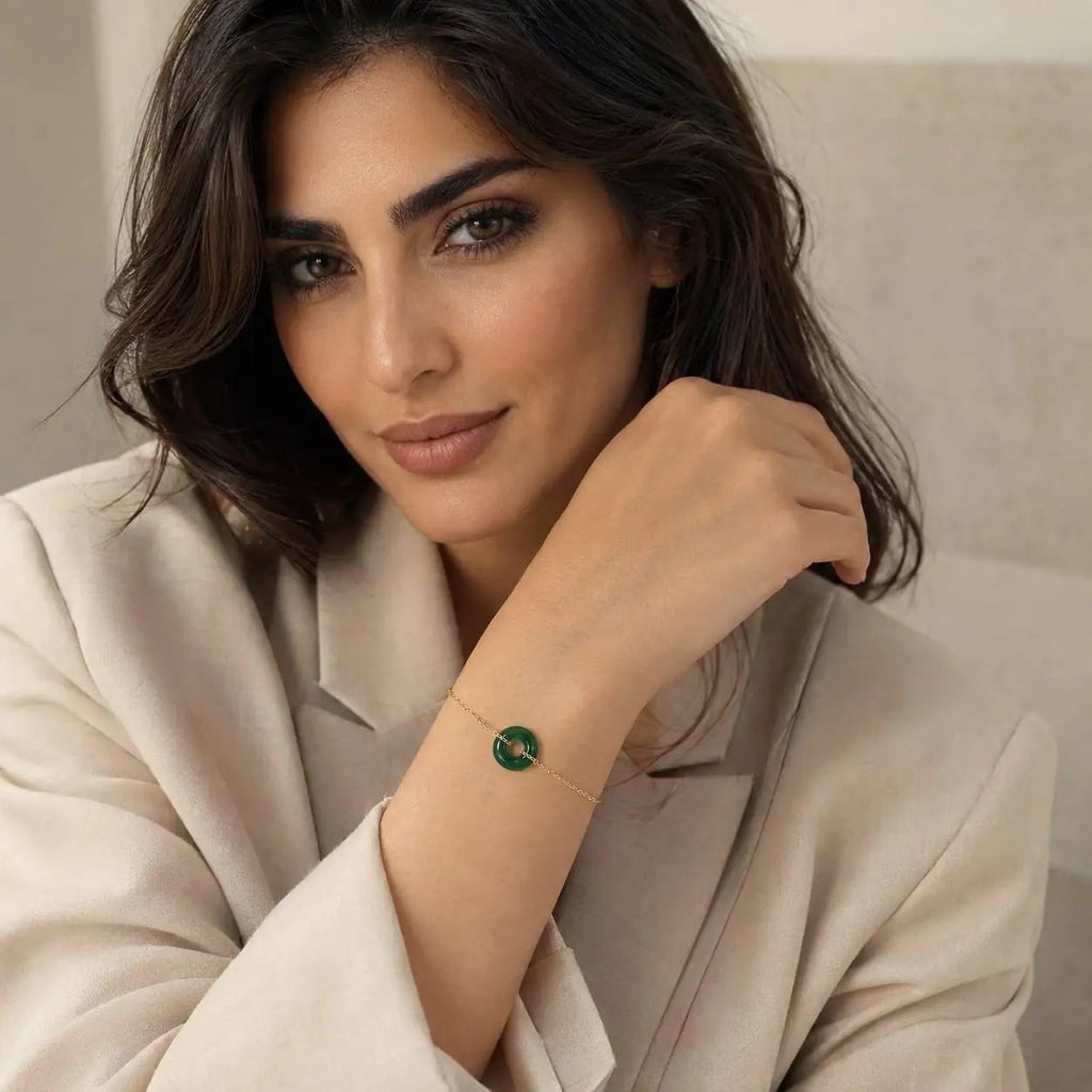 Model wearing a green aventurine donut bracelet