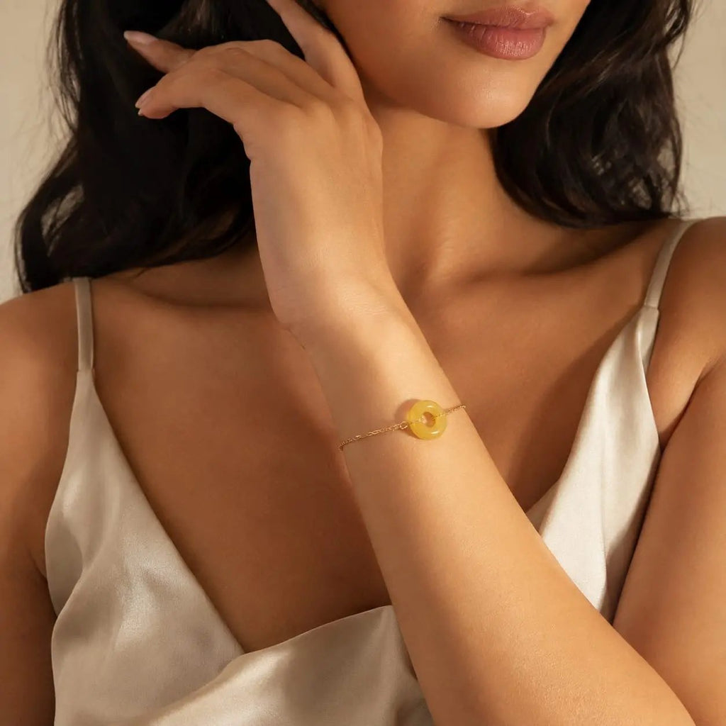 Model wearing a yellow citrine donut bracelet by SAMVELLI