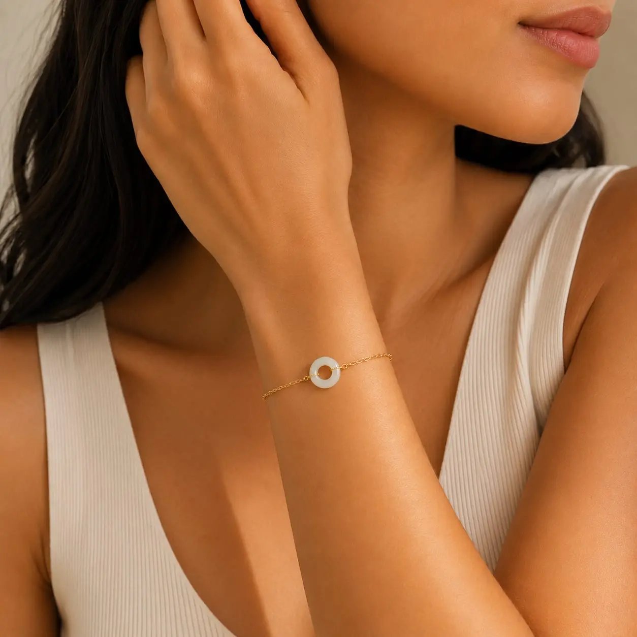 Model wearing a white moonstone donut bracelet by SAMVELLI