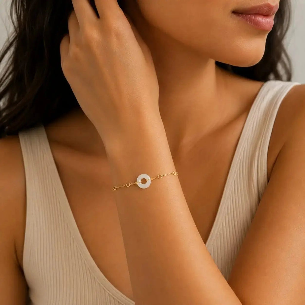 Model wearing a white howlite donut bracelet by SAMVELLI
