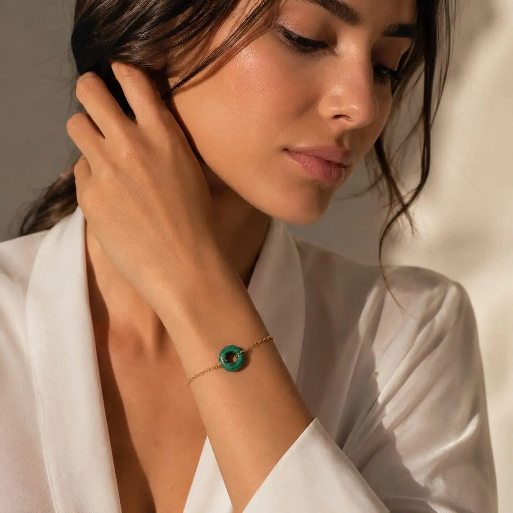 Model wearing a green malachite donut bracelet by SAMVELLI