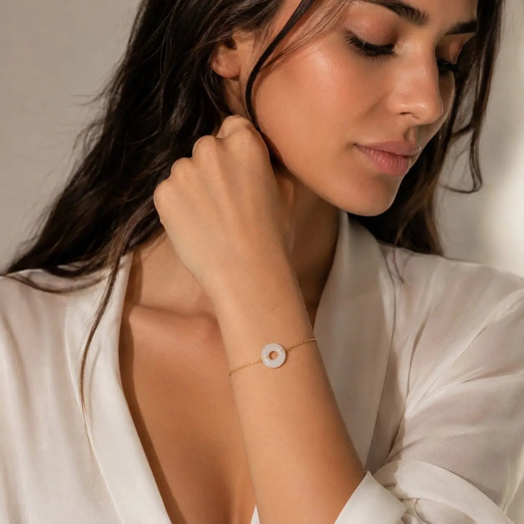 Model wearing a white gemstone donut bracelet by SAMVELLI